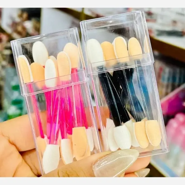 Pink and black dual ended eyeshadow sponge applicators in cases