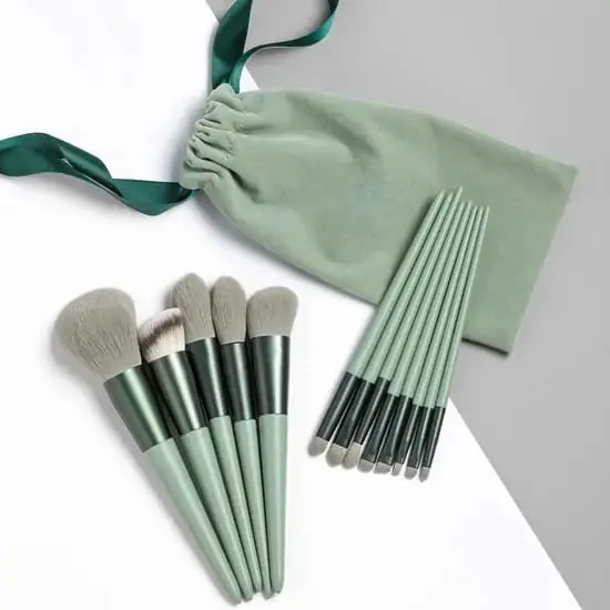 Green thirteen piece face and eye makeup brush set with pouch