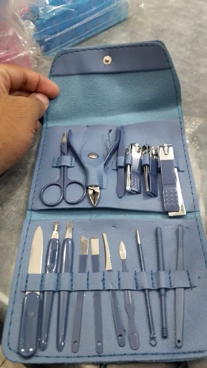 Manicure pedicure travel case held open by hand