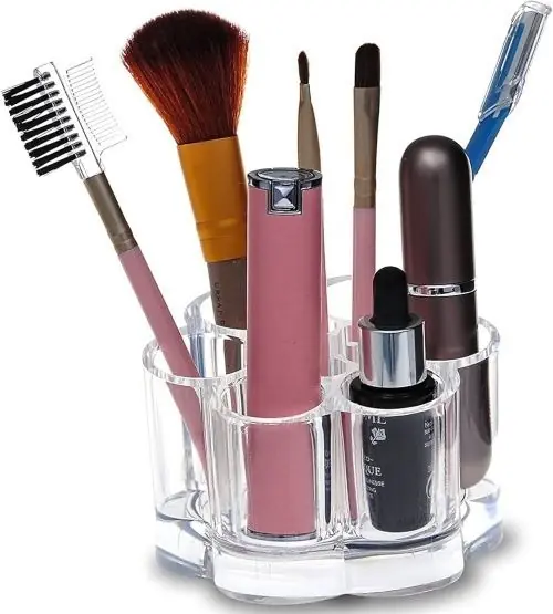 Six slot clear acrylic makeup organizer holding brushes and lip products